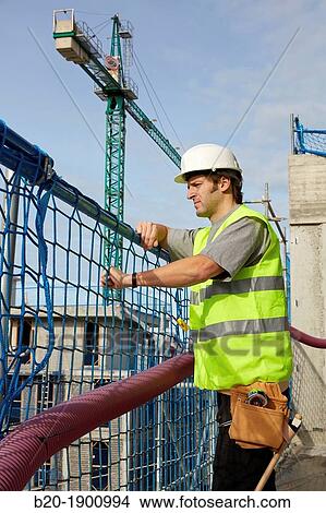Mason, Bricklayer with personal protective equipment, PPE, Apartment Building under construction, Donostia, San Sebastian, Gipuzkoa, Basque Country, Spain View Large Photo Image Picture - Mason, Bricklayer with personal protective equipment, PPE, Apartment Building under construction, Donostia, San Sebastian, Gipuzkoa, Basque Country, Spain. Fotosearch