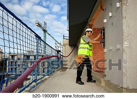 Mason checking the level of a wall, Bricklayer with personal protective equipment, PPE, Apartment Building under construction, Donostia, San Sebastian, Gipuzkoa, Basque Country, Spain View Large Photo Image Stock Image - Mason checking the level of a wall, Bricklayer with personal protective equipment, PPE, Apartment Building under construction, Donostia, San Sebastian, Gipuzkoa, Basque Country, Spain. Fotosearch