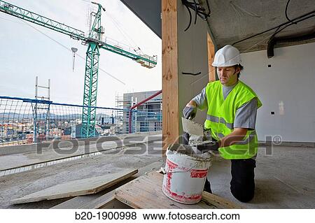 Mason with trowel, Bricklayer with personal protective equipment, PPE, Apartment Building under construction, Donostia, San Sebastian, Gipuzkoa, Basque Country, Spain View Large Photo Image Stock Photo - Mason with trowel, Bricklayer with personal protective equipment, PPE, Apartment Building under construction, Donostia, San Sebastian, Gipuzkoa, Basque Country, Spain. Fotosearch
