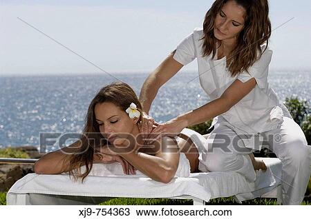 Massage on the lawn facing the sea. View Large Photo Image Stock Image - Massage on the lawn facing the sea.. Fotosearch