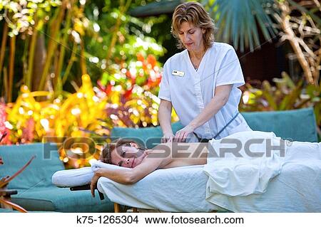 Picture - massage therapist. Fotosearch
