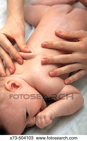 Massaging baby's back View Large Photo Image Stock Image - Massaging baby's back. Fotosearch