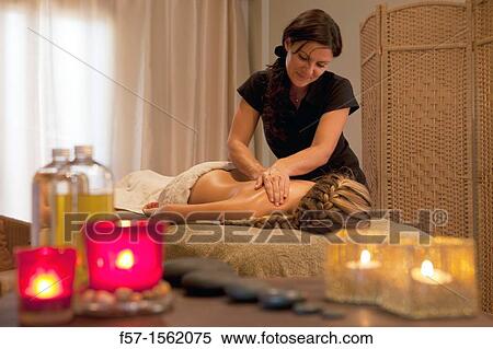 Masseuse massaging a woman View Large Photo Image Stock Photography - Masseuse massaging a woman. Fotosearch