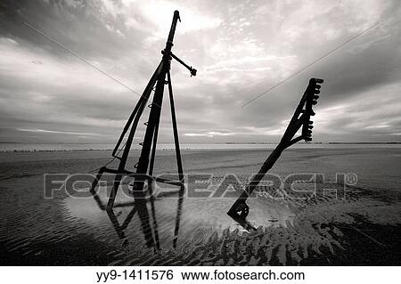 Stock Photograph - Mast of sunken ship at Jekyll Point B&W - Jekyll Island, Georgia USA. Fotosearch