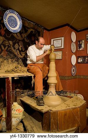 Master potter Ahmet at work inside the Firca Ceramics shop Sultanahmet, Istanbul View Large Photo Image Stock Photo - Master potter Ahmet at work inside the Firca Ceramics shop Sultanahmet, Istanbul. Fotosearch
