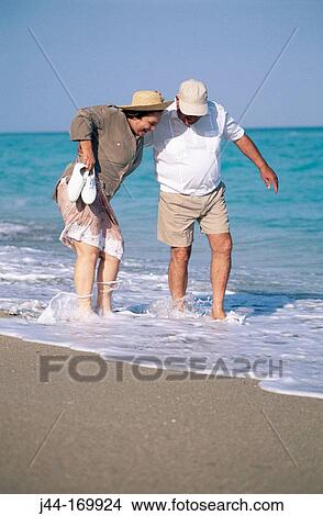 Mature couple at the beach View Large Photo Image Picture - Mature couple at the beach. Fotosearch
