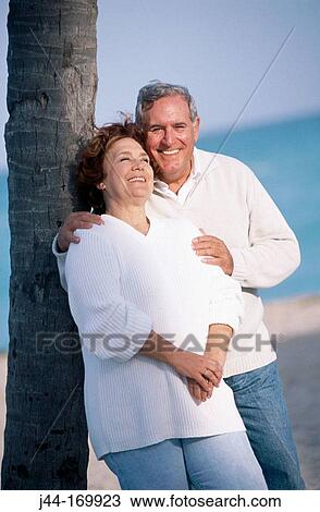 Mature couple at the beach View Large Photo Image Stock Image - Mature couple at the beach. Fotosearch