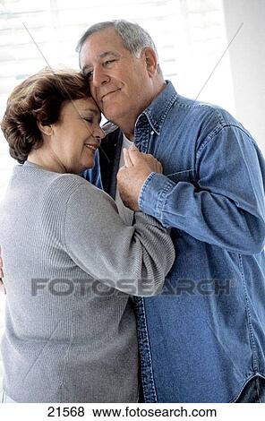Mature couple dancing in the house View Large Photo Image Stock Photo - Mature couple dancing in the house. Fotosearch