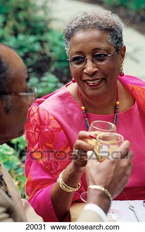Mature couple drinking champagne View Large Photo Image Stock Image - Mature couple drinking champagne. Fotosearch