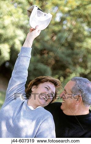 Mature couple enjoying outdoors View Large Photo Image Stock Photo - Mature couple enjoying outdoors. Fotosearch
