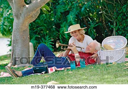 mature couple having a picnic View Large Photo Image Stock Photo - mature couple having a picnic. Fotosearch