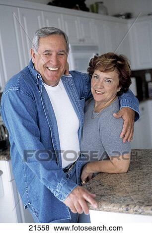 Mature couple in the kitchen View Large Photo Image Stock Photo - Mature couple in the kitchen. Fotosearch