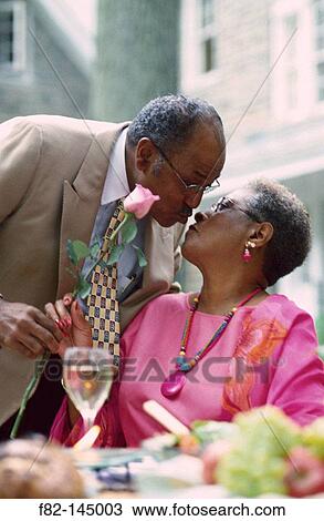Mature couple kissing View Large Photo Image Stock Image - Mature couple kissing. Fotosearch