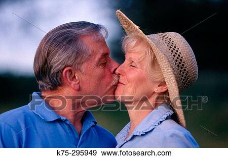 Mature couple kissing View Large Photo Image Stock Photo - Mature couple kissing. Fotosearch