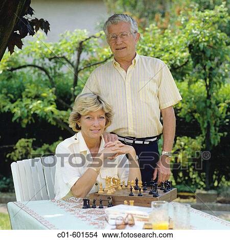 Mature couple's portrait in garden. View Large Photo Image Picture - Mature couple's portrait in garden.. Fotosearch