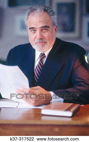 Mature executive businessman at desk View Large Photo Image Stock Image - Mature executive businessman at desk. Fotosearch