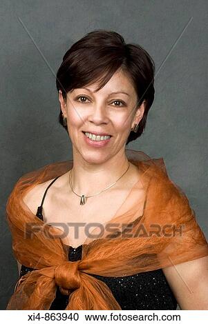 Mature latin woman looking in to the camera View Large Photo Image Stock Image - Mature latin woman looking in to the camera. Fotosearch