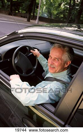 Mature man in a car View Large Photo Image Picture - Mature man in a car. Fotosearch