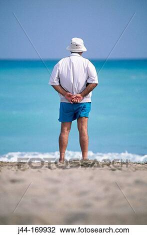 Stock Image - Mature man looking at sea. Fotosearch