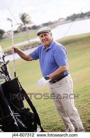 Mature man playing golf View Large Photo Image Stock Image - Mature man playing golf. Fotosearch