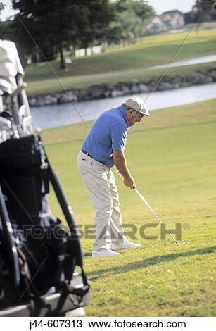Mature man playing golf View Large Photo Image Stock Image - Mature man playing golf. Fotosearch