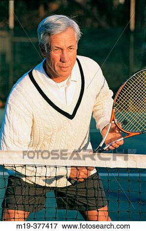 Stock Photo - mature man playing tennis. Fotosearch