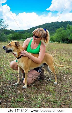 Mature Woman, 44 years old, in fitness outfit with dog View Large Photo Image Picture - Mature Woman, 44 years old, in fitness outfit with dog. Fotosearch