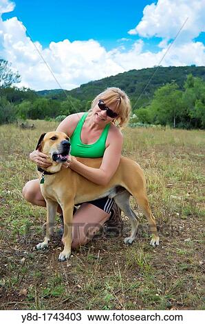 Mature Woman, 44 years old, in fitness outfit with dog View Large Photo Image Stock Image - Mature Woman, 44 years old, in fitness outfit with dog. Fotosearch