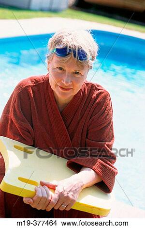 Picture - mature woman after a swiming workout. Fotosearch