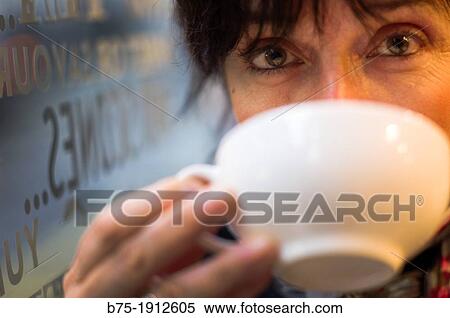 mature woman drinking coffee in a Tea Shop in Soho, London, England, UK View Large Photo Image Stock Photography - mature woman drinking coffee in a Tea Shop in Soho, London, England, UK. Fotosearch