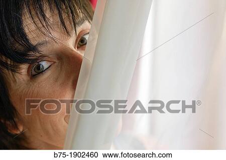 Stock Image - mature woman looking relaxed and cheerful. Fotosearch