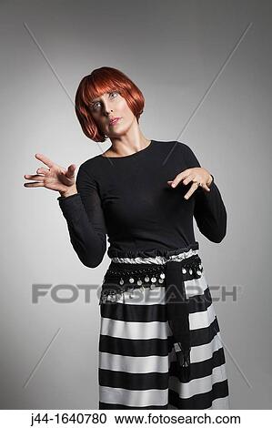 Mature woman standing as a mannequin View Large Photo Image Stock Image - Mature woman standing as a mannequin. Fotosearch