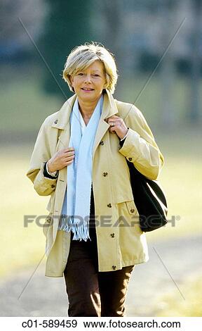 Mature woman strolling View Large Photo Image Stock Photo - Mature woman strolling. Fotosearch