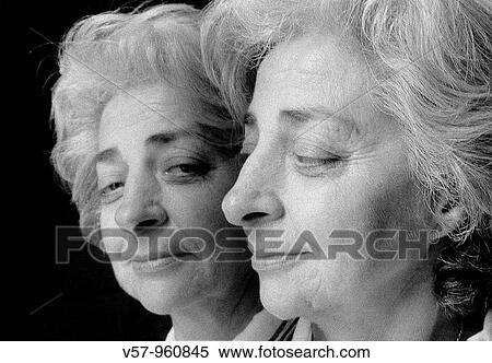 Mature woman's face Mirrored image. Black and White. View Large Photo Image Stock Photography - Mature woman's face Mirrored image. Black and White.. Fotosearch
