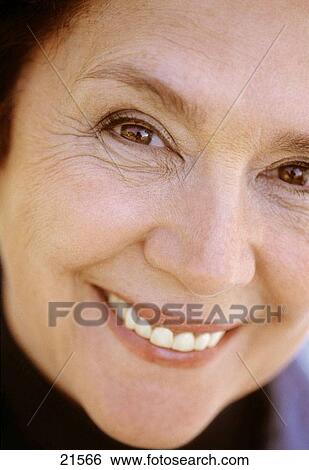 Stock Photograph - Mature woman's face smiling. Fotosearch
