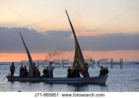 Mauritius, Trou aux Biches, sunset, sailboats, people View Large Photo Image Stock Image - Mauritius, Trou aux Biches, sunset, sailboats, people. Fotosearch