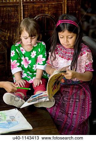 Mayan girl reading to friend View Large Photo Image Stock Image - Mayan girl reading to friend. Fotosearch