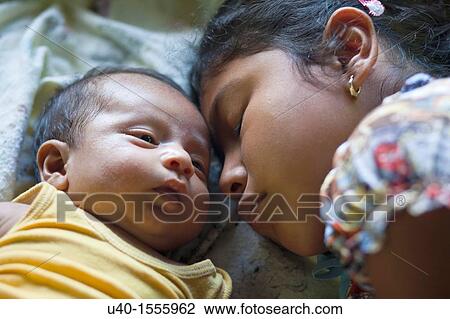 Mayan girl with baby brother View Large Photo Image Stock Image - Mayan girl with baby brother. Fotosearch
