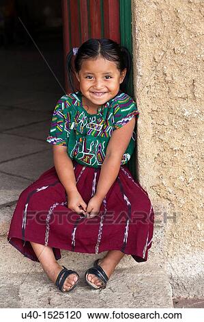 Stock Image - Mayan Girl with Mother. Fotosearch