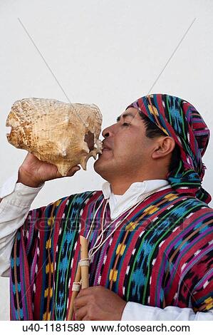 Mayan Man playing Conch View Large Photo Image Stock Photo - Mayan Man playing Conch. Fotosearch