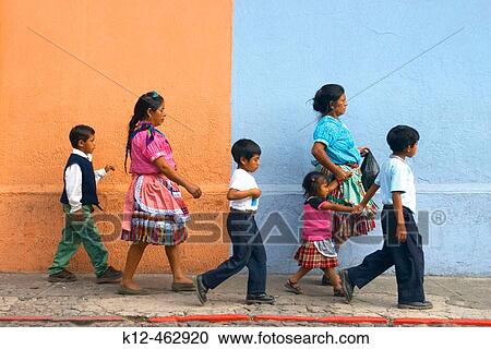 Mayan woman and children walking in front a painted wall. Antigua Guatemala. Sacatep? quez Region. Guatemala View Large Photo Image Stock Image - Mayan woman and children walking in front a painted wall. Antigua Guatemala. Sacatep? quez Region. Guatemala. Fotosearch