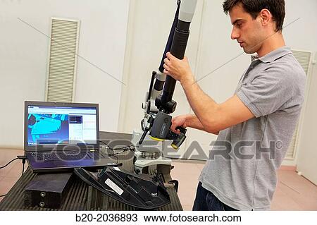 Stock Image - MCAx measuring arm. Coordinate measuring machine portable with escanner for contactless measurement. Measurement service. Innovative Metrology applied. Sariki Metrology. Elgoibar. Gipuzkoa. Basque Country. Spain.. Fotosearch