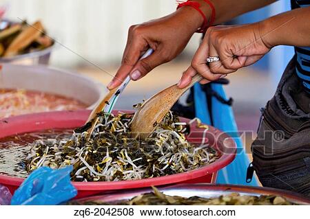 Meal Preparation on a Market in Phnom Penh, Cambodia View Large Photo Image Stock Photo - Meal Preparation on a Market in Phnom Penh, Cambodia. Fotosearch