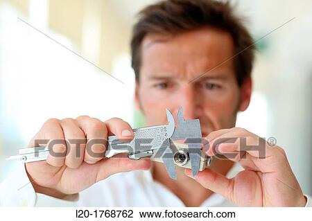 Stock Image - Measurement with calipers, Tecnalia Foundation, Technology and Research Centre, San Sebastian Technological Park, Donostia, Gipuzkoa, Basque Country, Spain. Fotosearch