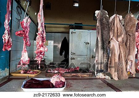 Meat at a butcher's shop in the market area of the ancient medina, Tiznit, Morocco. View Large Photo Image Stock Image - Meat at a butcher's shop in the market area of the ancient medina, Tiznit, Morocco.. Fotosearch