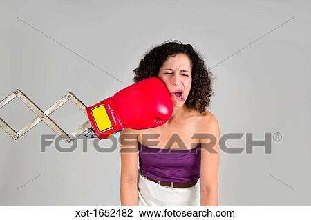 Mechanical boxing devices punches a young woman in the face View Large Photo Image Stock Image - Mechanical boxing devices punches a young woman in the face. Fotosearch