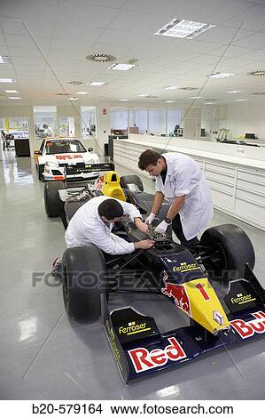 Mechanics working on racing car, World Series, Formula 3000. Epsilon Euskadi, car technology high performance centre, Azkoitia, Gipuzkoa, Basque Country View Large Photo Image Picture - Mechanics working on racing car, World Series, Formula 3000. Epsilon Euskadi, car technology high performance centre, Azkoitia, Gipuzkoa, Basque Country. Fotosearch