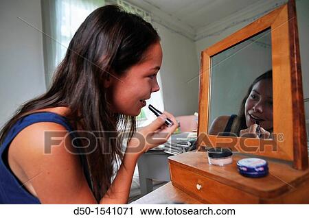 MEDEVI SWEDEN 22 year old girl applies lip gloss. View Large Photo Image Stock Image - MEDEVI SWEDEN 22 year old girl applies lip gloss.. Fotosearch