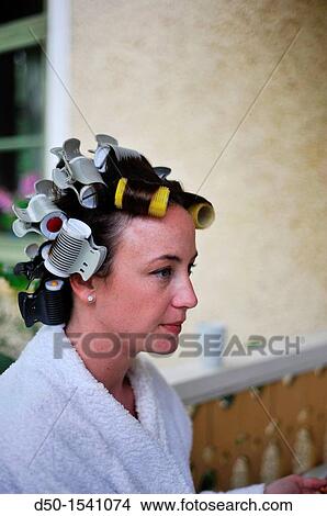 Picture - MEDEVI SWEDEN Bride to be has hair in rollers before the wedding.. Fotosearch