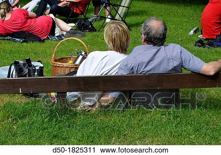 MEDEVI SWEDEN Couple at midsummer sitting on the grass and enjoying a concert. View Large Photo Image Stock Image - MEDEVI SWEDEN Couple at midsummer sitting on the grass and enjoying a concert.. Fotosearch